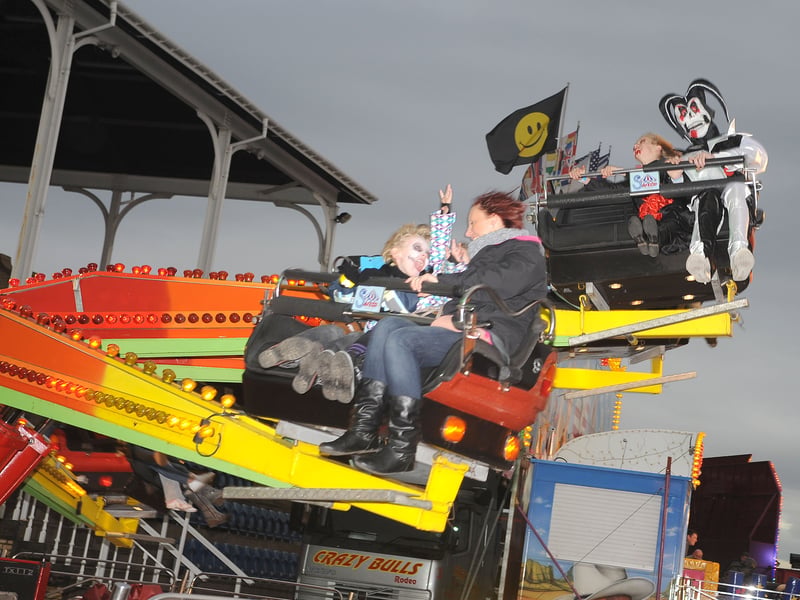 People have dressed up in costume enjoy the fun fair at the Halloween Spooktacular at Doncaster Racecourse. 