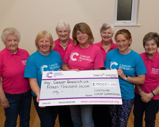 The Coleraine Cancer Research UK Committee, pictured with this years fundraising to January 2026, a total of £15,000  WK42-26-015CR 