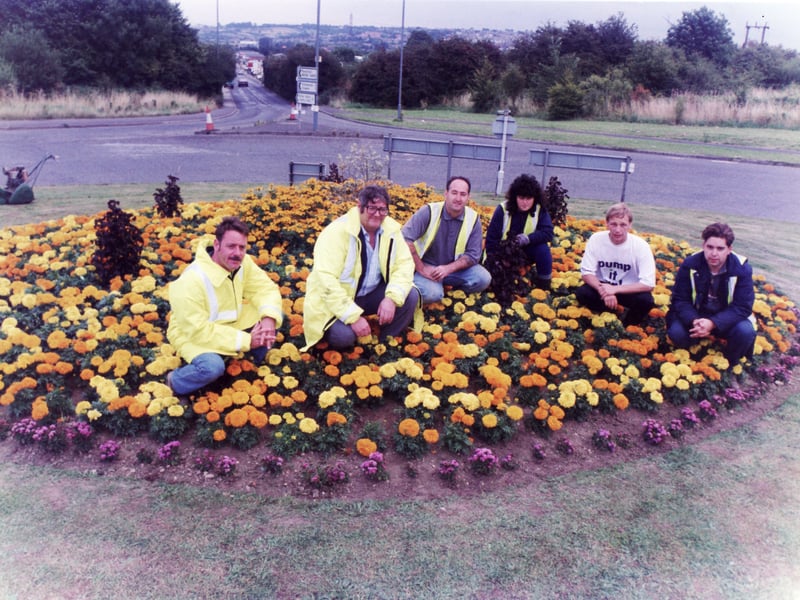 Sheffield Corporation recreation workers on the traffic island at Station Road, Mosborough, which is a blooming picture after their efforts to gain sponsorship for the planting of flowers - 25th August 1993