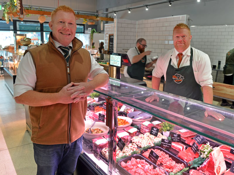 Ed and Tom Armstrong at the counter in the new Matlock shop.