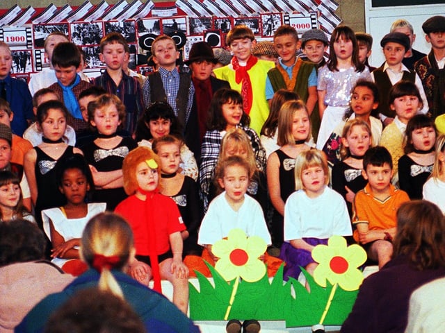 Intake Schools " Dash Through the Decades" charting the last 100 years. Year 3 sing to the audience.