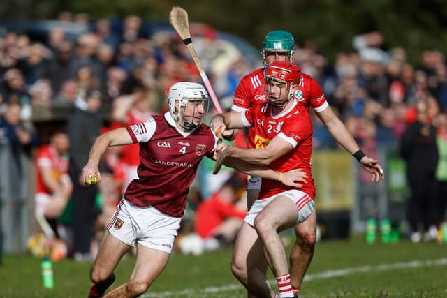 Cushendall's Fred McCurry in action against Loughgiel's Shan McGrath during their Senior Hurling Championship semi-final at Pairc McUílín, Ballycastle. Sunday's final has now been put back a week because of concerns about the weather.