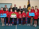Pupils at Gortin Primary School helped Newtownstewart Royal British Legion branch launch their Poppy Appeal 2026. Pictured are members of the student council, Mia Baxter, Grace Scott, Sophia Lucas, Ellie Warnock, Ross Warnock, James Orr, Scarlet Black, Lottie Armstrong, Epsie Alison and Harvey Wauchob, with Derek Hussey and branch officers Hazel Ross, secretary, James Baxter, president and Lord Lieutenant for County Tyrone, Allen Scott, chairman and Victoria Ross, vice-chairman. AN441526  