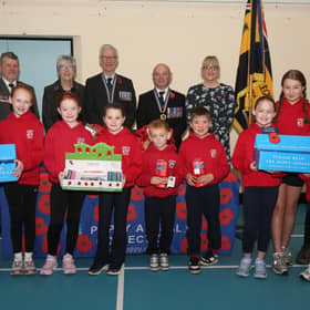 Pupils at Gortin Primary School helped Newtownstewart Royal British Legion branch launch their Poppy Appeal 2026. Pictured are members of the student council, Mia Baxter, Grace Scott, Sophia Lucas, Ellie Warnock, Ross Warnock, James Orr, Scarlet Black, Lottie Armstrong, Epsie Alison and Harvey Wauchob, with Derek Hussey and branch officers Hazel Ross, secretary, James Baxter, president and Lord Lieutenant for County Tyrone, Allen Scott, chairman and Victoria Ross, vice-chairman. AN441526  