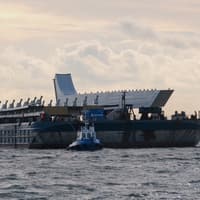 Barge brings in pieces of  Bridge over Narrow Water.