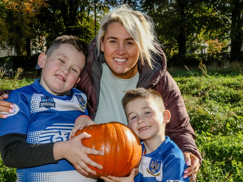 Amy Molloy with her children Seth and Jonah, with their pumpkin.