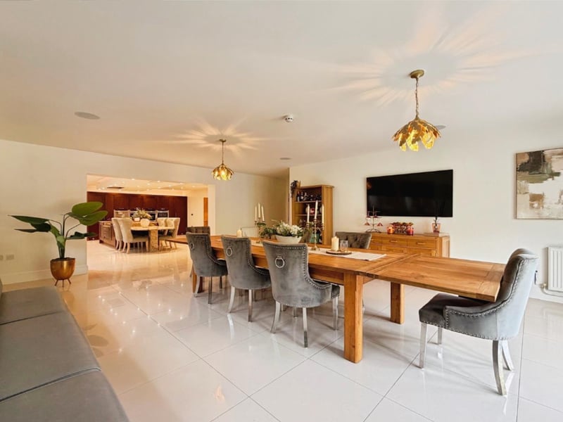 Designed with entertaining in mind, the impressive formal dining room provides an elegant setting for both intimate dinners and larger gatherings.