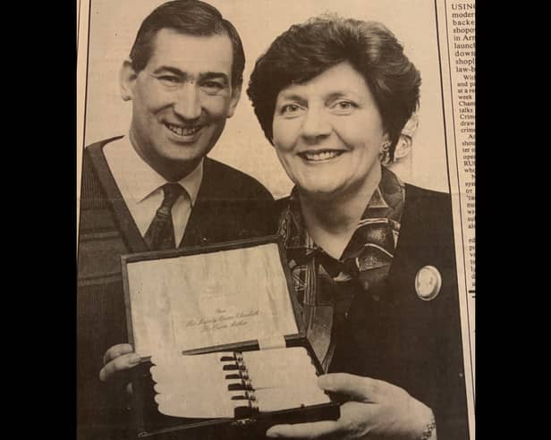 William and Linda Anderson display the set of cutlery given to them by the Queen Mother.