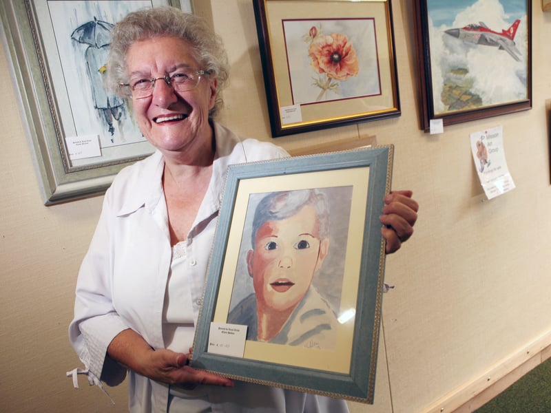 Eileen Holden from Misson Art Club, with one of her paintings at Bawtry library.