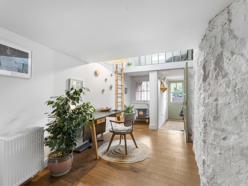 On entering, the former garage has been cleverly transformed into a stylish entrance hall with dedicated office space.