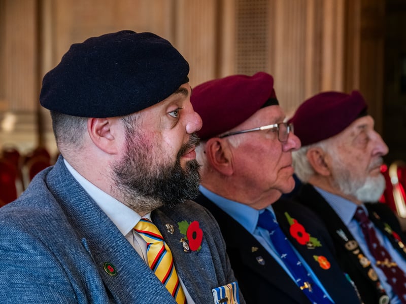 Veterans Simon Brown, Paul Bradford and Neil Munro, wearing their poppies.
