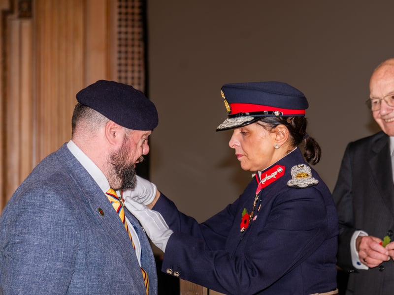 Veteran Simon Brown, receiving his poppy from Professor Adeeba Malik CBE Lord-Lieutenant of West Yorkshire.