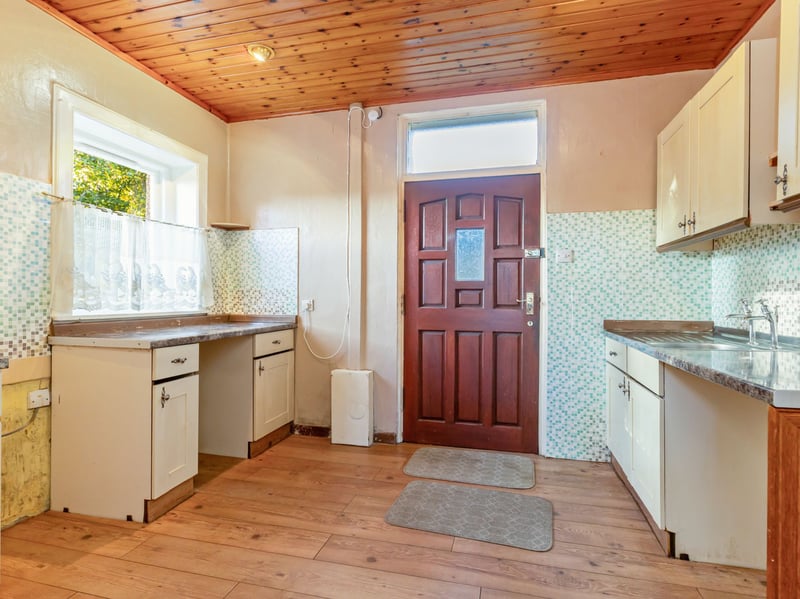 The separate kitchen, with external access, offering scope for complete modernisation.