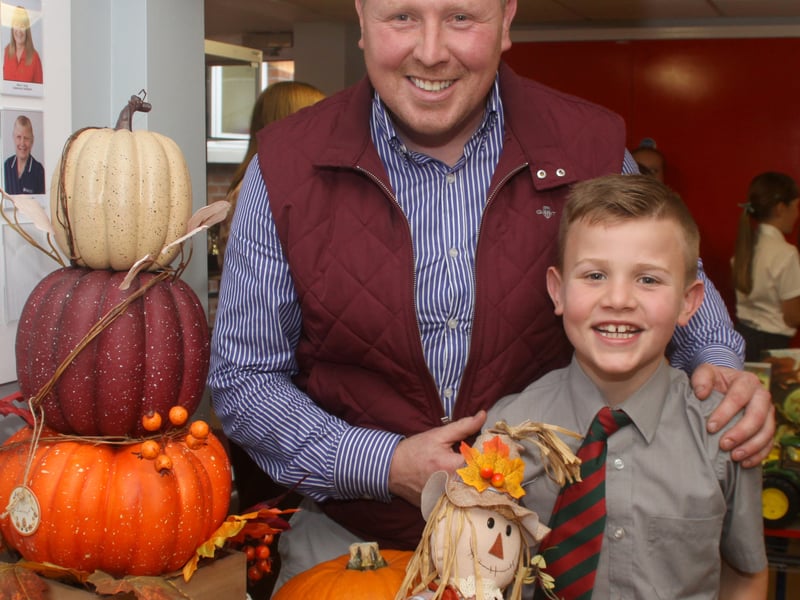 Reuben McCall with his Dad, Wayne at the school Harvest service.