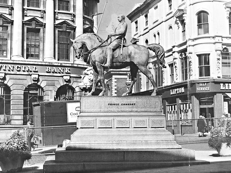 The famous equestrian statue of the Prince Consort, Prince Albert, stands proudly in Queen Square, Wolverhampton, in this photograph from September 1966. By the 1960s, the iconic landmark had weathered numerous local debates, with town planners and residents putting forward proposals ranging from relocating the bronze monument to West Park to even replacing it with a statue of the Duke of Edinburgh in polo kit. Do you remember meeting friends by "The Man on the Horse" in Queen Square back in the 1960s?