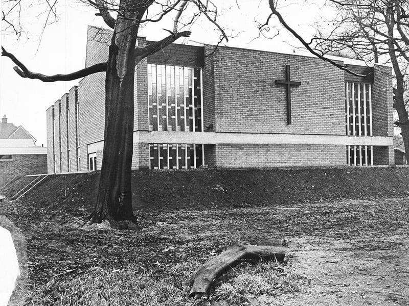The new Congregational Church on Old Fallings Lane, Wolverhampton, stands nearly finished in February 1966. Framed by winter trees, the modern brick structure featuring a prominent wall-mounted cross was fast approaching completion to serve the local growing neighbourhood. Do you remember when this new church building opened on Old Fallings Lane back in 1966?