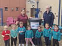 Pupils from Rainbow Community Playgroup, Omagh with their new NI Water waterbutt. SU3744CD26