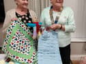 President Kathleen thanks Mrs Betty Fiddes from Project Linus (UK) who is displaying some of the quilts.

 
