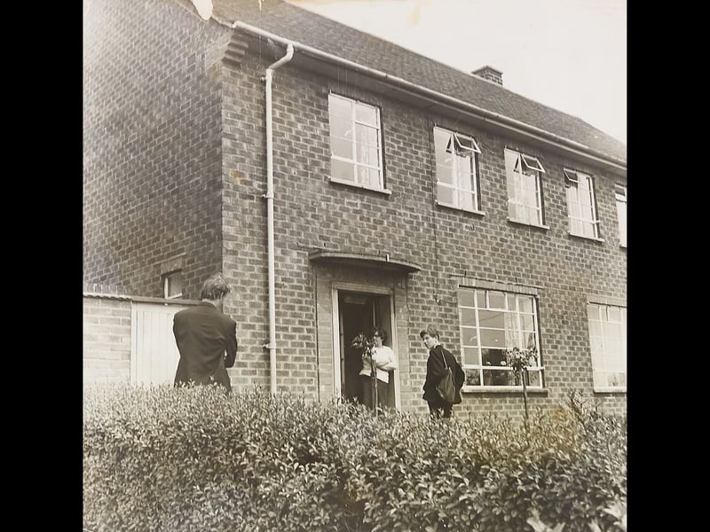 A quiet residential scene outside a council property in Fordhouses, Wolverhampton, captured on June 9, 1966. Around this time, Wolverhampton’s housing committee was preparing a comprehensive review of the council’s housing financial policy following rent increases introduced the previous year. Do you remember living in or visiting Fordhouses during the mid-1960s?