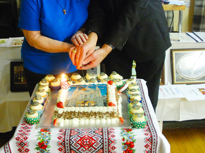 Cutting the Golden Jubilee Cake are Margaret Moloney and Bishop Fintan Monahan