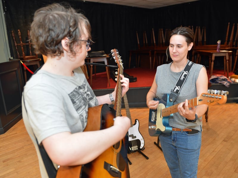 Music tutor Jess Allen teaching Ryan.