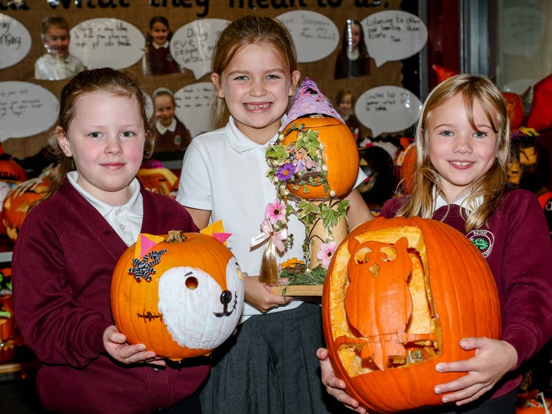 Emma, Remi and Grace with their grand pumpkin designs. AM264413