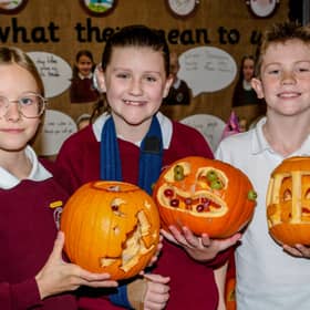 P7 pupils Ellie, Mya and Hayden, who took part in the Bush PS pumpkin carving competition. 
