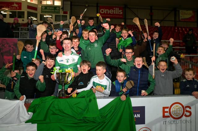 Shamrocks captain Aodhan Furlong holding the cup, surrounded by fans. Picture: Brendan Monaghan.