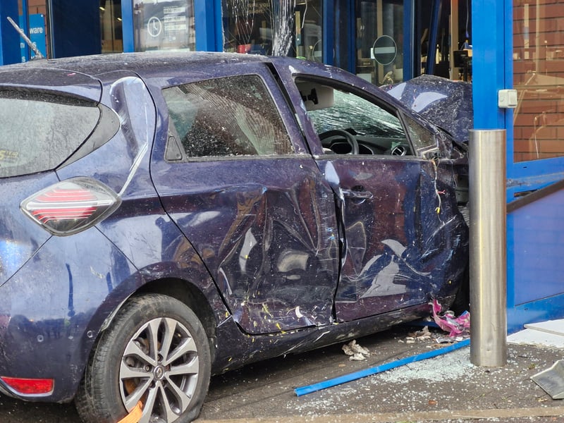 The damage on the car was visible as it was dragged out of the store
