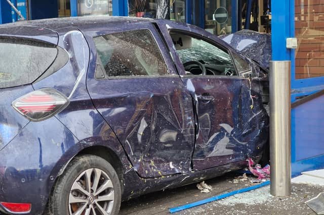 The damage on the car was visible as it was dragged out of the store