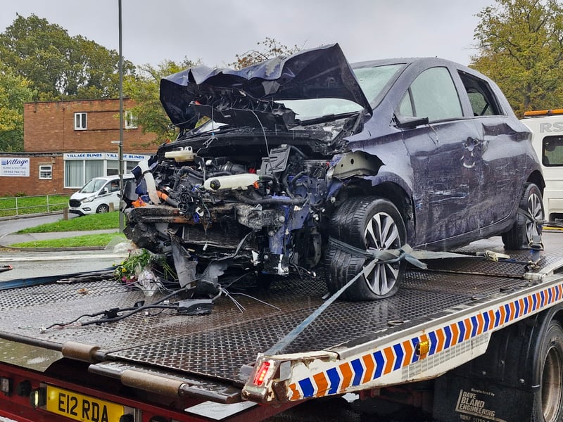 The front of the car was completely destroyed, with debris and detritus visible