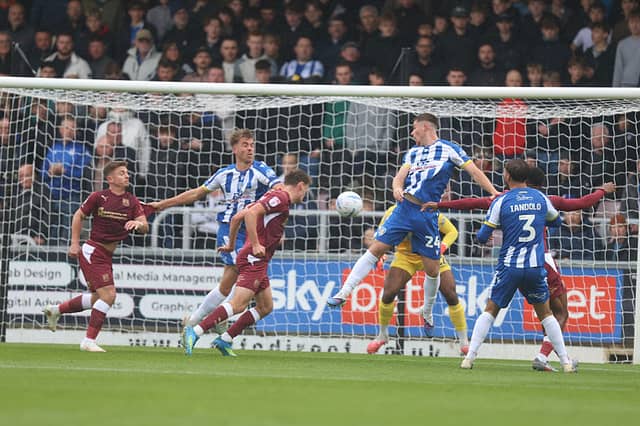 Matty Warhurst heads Cobblers into the lead against Colchester