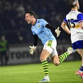 Niall Morgan, of Edendork, turns to celebrate after scoring an injury time score against  Errigal Ciaran during the Tyrone Senior Football Championship  final replay.