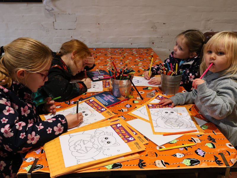 Clockwise from left, Kiera, 8, Penny, 7, Robyn, 3, and Layla, 2, busy drawing. Spooky fun and Portsmouth100 Lions at Fort NelsonPicture: Chris Moorhouse (241026-094)