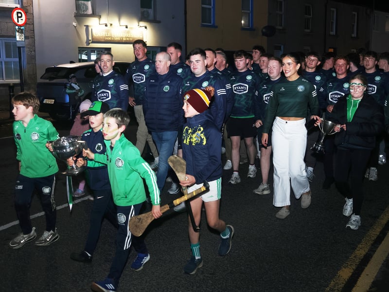 Kilmallock players walk through the town celebrating their Limerick SHC win