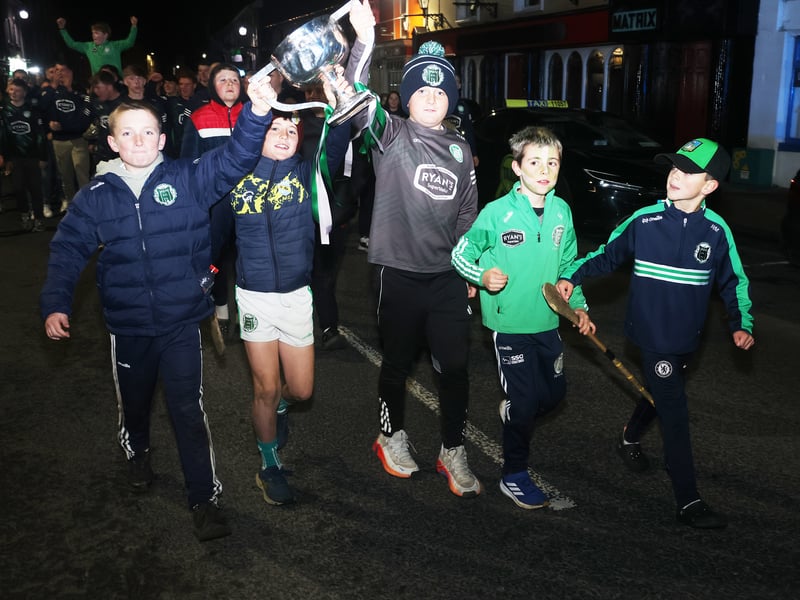 Some young fans with the Daly Cup at the Kilmallock homecoming