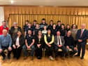 The council chair of Fermanagh and Omagh District Council with councillors and members of Clanabogan Young Farmers' Club.