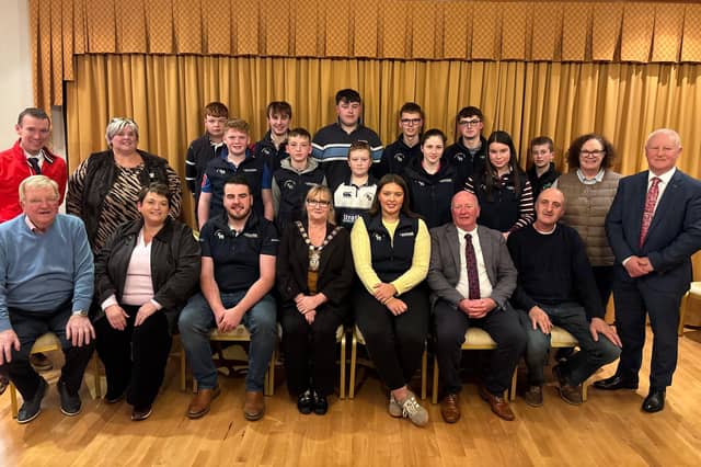 The council chair of Fermanagh and Omagh District Council with councillors and members of Clanabogan Young Farmers' Club.