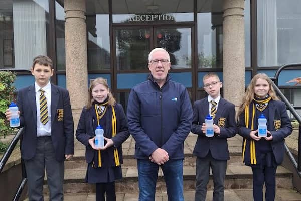 Omagh Academy pupils with their new reusable water bottles as part of NI Water’s Refillution campaign. SU4344CD26