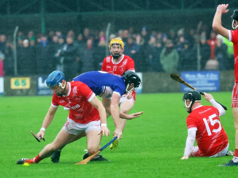 Eoin Fitzgibbon tries to win possession for Doon in their game with Caherline