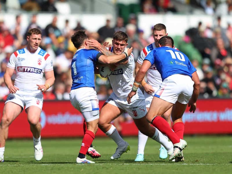 England hooker Brad O'Neill takes on the French defence