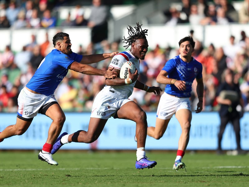 Wigan star Junior Nsemba breaking through the French defensive line