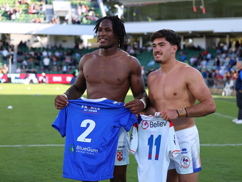 England's Junior Nsemba and France's Guillermo Aispuro-Bichet swap shirts at the end of the game