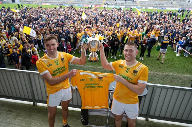 Charlie Carr and Stephen McConville lift the Frank O'Hare Cup after beating Burren in the Down Senior Championship Final on Sunday.