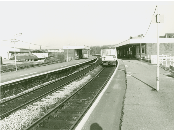 	
The new Pacer train waiting to travel to Preston from Burnley Central Station. This photograph was taken shortly before the second line was removed in 1986.

Burnley Central Station was built in 1849 as part of an infrastructure project that connected Burnley to Bury via rail. Between 1871 and 1944 it was known as Bank Top Station. In the 1960's the routes to Liverpool, Manchester and later Skipton were lost, thus making it a station on a dead end branch line, which affected the station quite badly. During this period the station was redeveloped and the original Victorian buildings were demolished.