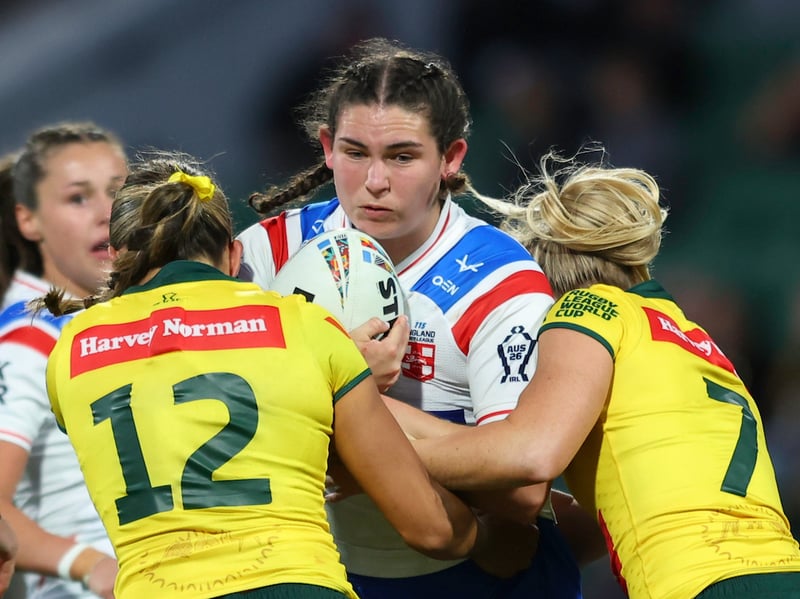 Wigan forward Meg Williams on the charge for England