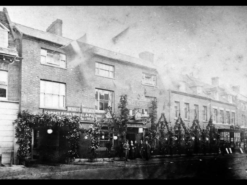 The Corbet Arms Hotel, Market Drayton, and the street nearby are dressed with patriotic flags and decorations, so there is obviously some sort of celebration.  Or a very important visitor is expected - it says "Welcome" in big letters above the entrance. Presumably the hotel proprietors are in the doorway. The name Wycherley is above the signboard starting "Corbet Arms Hotel & Posting... " The 1891 census has a Richard Wycherley down as the proprietor or whatever. 