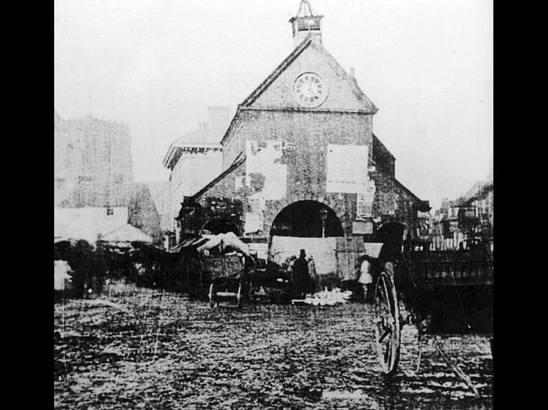 The old Newport town hall, with a market under way. It was demolished some time between 1858 and 1860. Does that tower look crooked to you? On the left is the town's parish church. You'd have wanted to wipe your feet after walking around the town in those days.