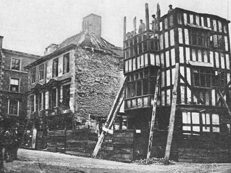 A timbered house at the corner of Mardol and Claremont Street being demolished, probably in 1867, but in any event during the demolition of buildings to make way for the building of a new Shrewsbury market hall in the 1860s. The photo is believed to have been taken by John Franklin of Castle Street.