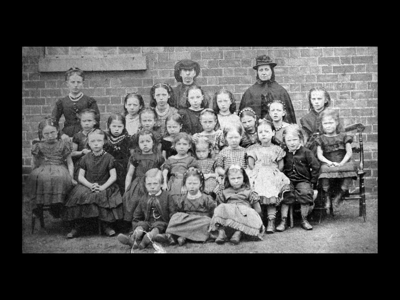 ...which, as you can see, shows the girls at the same school - in those days boys and girls were educated separately in the same school building. Ken Lewis, archivist at Ketley History Group, pointed out that the brick background was identical to that in the previous picture featuring young Cadman. Ken told us that as in 1871 the Cadmans were living in Forge Row, Malinslee, he thought he would have gone to Malinslee School which was only a few yards away. If that theory is correct, then this photo and the previous one show children at Malinslee School.